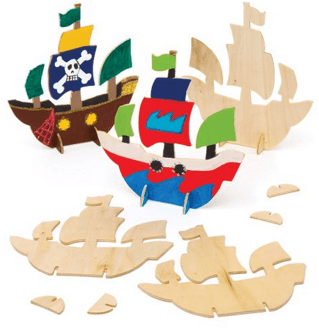 Wooden pirate ship craft with colorful flags and cut-out pieces.