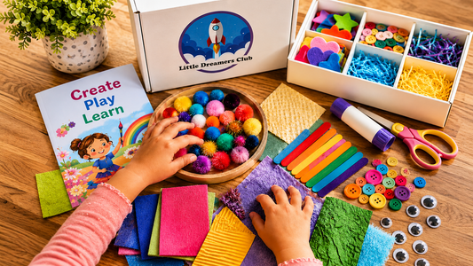 Child exploring colorful textured craft materials beside a Little Dreamers Club box and a “Create Play Learn” book