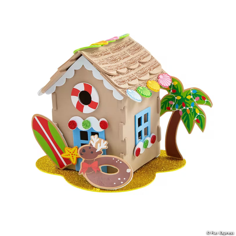 Decorative foam 3D beach house with palm tree and cookie decorations on a white background