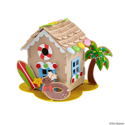 Decorative foam 3D beach house with palm tree and cookie decorations on a white background