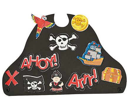 Pirate-themed decorative hat with various elements on a green background