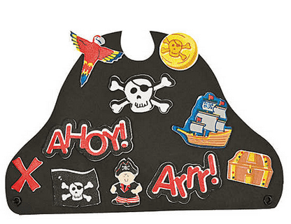 Pirate-themed decorative hat with various elements on a green background
