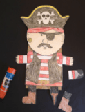 Pirate-themed craft with a hat, eye patch, and flag on a plain background