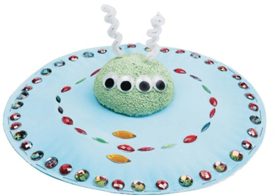 UFO with a green alien figure on a white background