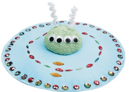 UFO with a green alien figure on a white background