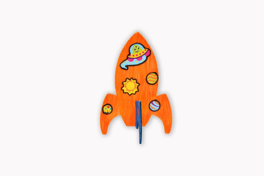 Wooden rocket ship with space-themed design on a white background