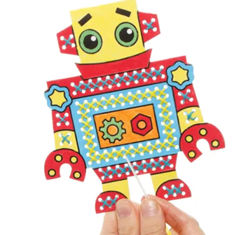 Colorful robot craft held by a hand against a white background