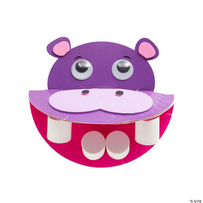 Purple hippo-shape craft with chompers and googly eyes on a transparent background