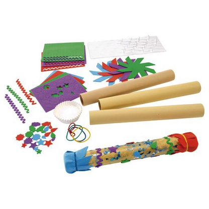 Assorted craft supplies including paper, ribbons, and decorative items on a white background to create a rain stick