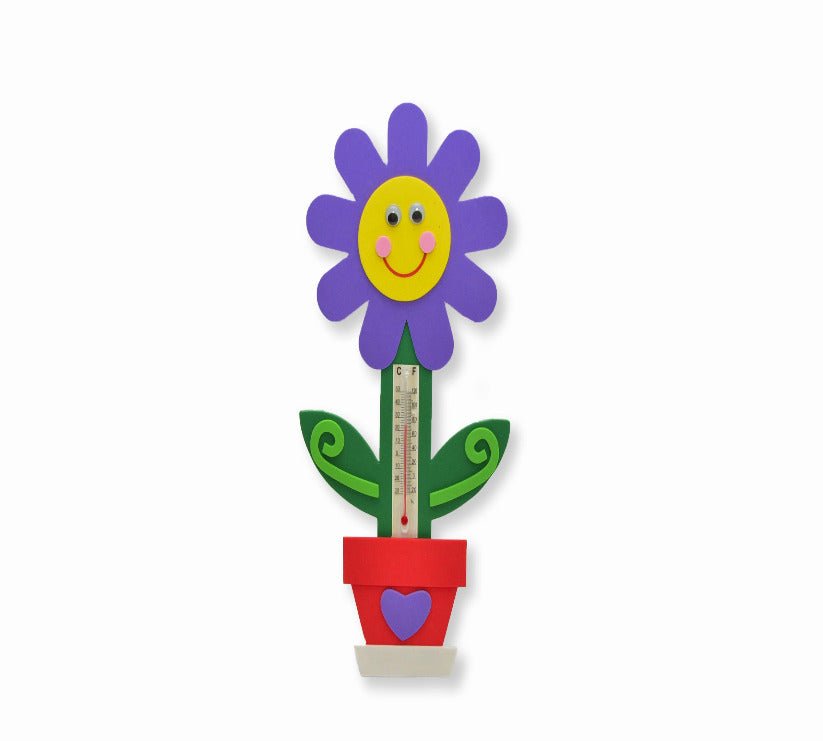 Colorful flower-shaped thermometer with a smiling face on a white background