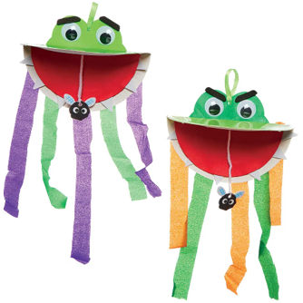 Two colorful Venus fly trap crafts on a white background