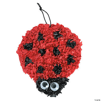 Red and black ladybug tissue craft on a white background