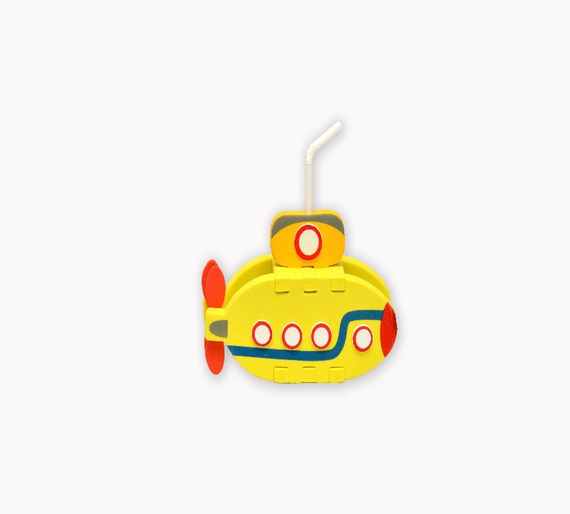 Yellow submarine-shaped foam craft with a straw on a white background
