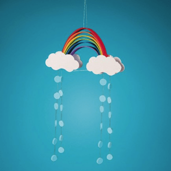 Colorful rainbow and clouds hanging against a blue background