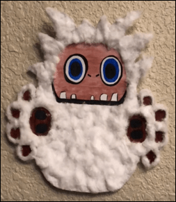 Image of yeti with a round face and white fur on a beige background
