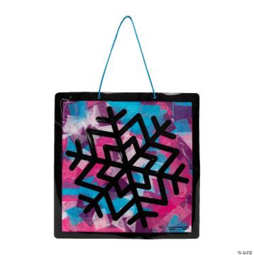 Snowflake craft with a colorful abstract design and black geometric pattern on a pink and blue background.