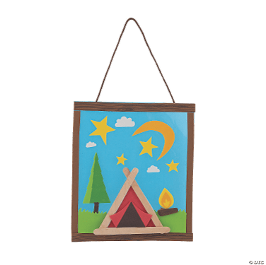 Decorative wall hanging craft with a tent, trees, and stars on a blue background.