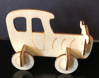 Wooden car model on a dark background