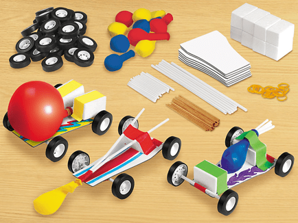 Children's STEM cars made from building blocks on a wooden surface