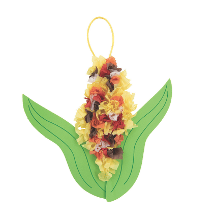 Decorative tissue paper corn in husk with  cob on a green leaf-shaped base
