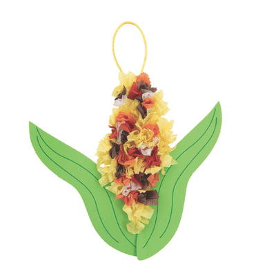 Decorative tissue paper corn in husk with  cob on a green leaf-shaped base