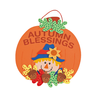 Decorative pumpkin craft with 'Autumn Blessings' text and a scarecrow on a transparent background