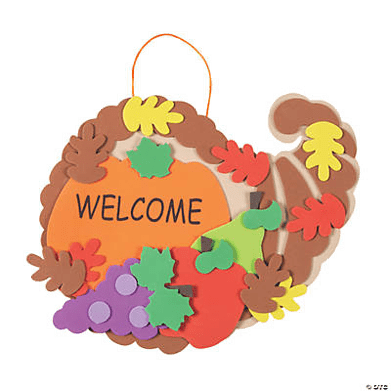 Decorative cornucopia craft with colorful leaves and a 'WELCOME' text on a green background
