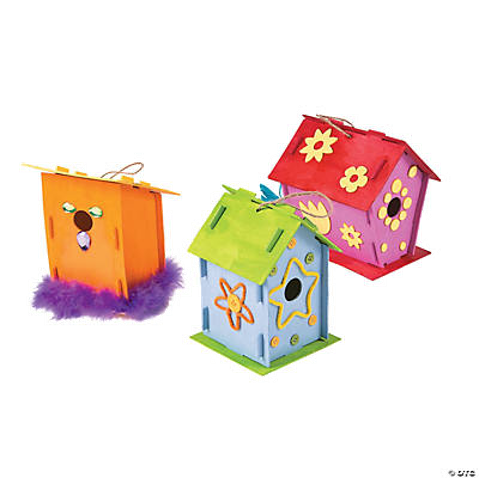 Colorful wooden bird houses on a white background