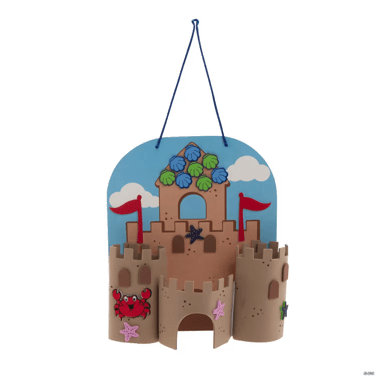 Decorative sandcastle craft with flags and sea creatures on a clear background