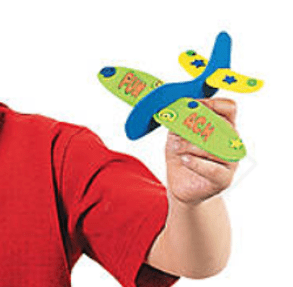 Colorful airplane held by a person wearing a red shirt.