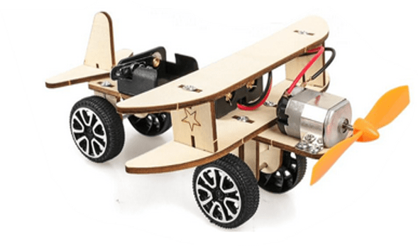 Wooden airplane with wheels and a propeller on a white background