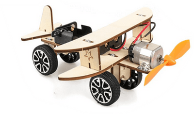 Wooden airplane with wheels and a propeller on a white background