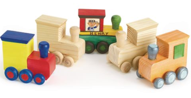 Wooden  train set with colorful cars on a white background