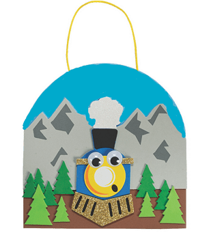Decorative train craft with mountains and trees on a green background