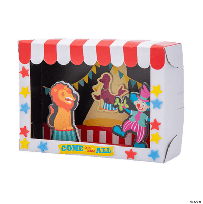 Carnival-themed cardboard craft with colorful decorations and cut-out figures of a lion, clown, and other performers.