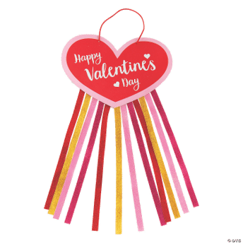 Heart-shaped Valentine's Day decoration with colorful ribbons on a green background