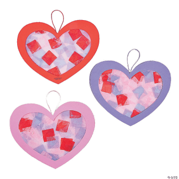 Three heart-shaped decorations with colorful patterns on a green background