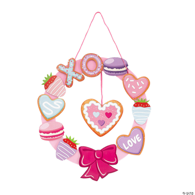 Valentine's Day-themed wreath with decorative elements on a white background