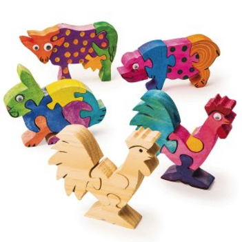 Set of colorful wooden animal puzzles on a white background