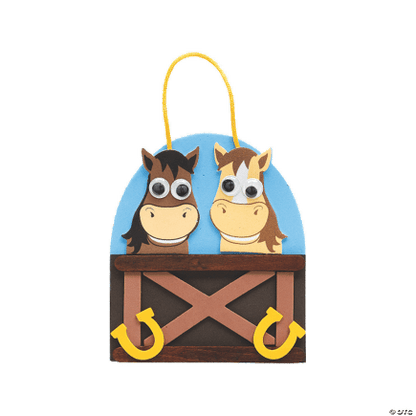 Decorative craft with two cartoon horses on a blue background