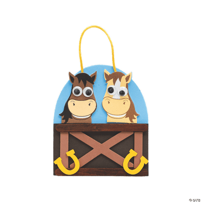 Decorative craft with two cartoon horses on a blue background