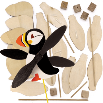 Wooden craft kit for building a puffin bird with unpainted pieces on a transparent background
