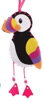 Colorful bird-shaped ornament with pink feet on a white background