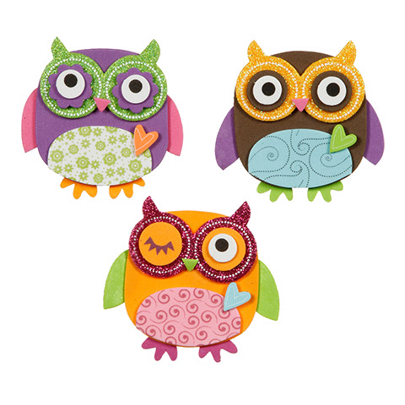 Three colorful glitter owl decorations on a white background